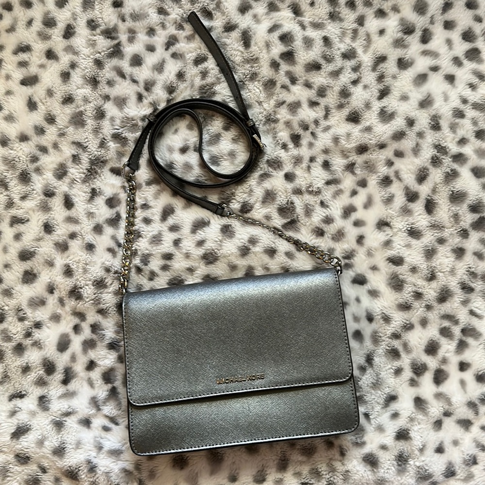 This is a gray Michael Kors over the shoulder purse